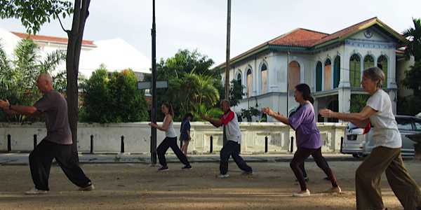 Group of TaiChi learners practicing outdoors